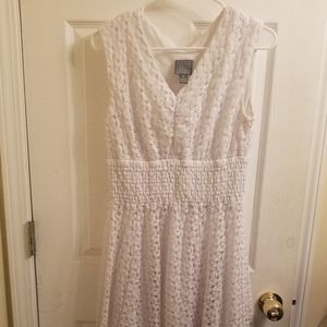 White sleeveless dress with crocheted stitching